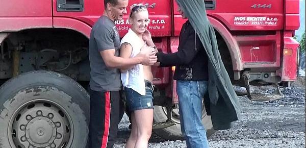  Construction site public gangbang threesome sex orgy with a cute blonde teen girl with nice perky tits and 2 hung guys with big dicks shoving their cocks in her mouth deep throat blowjob action and vaginal intercourse facking her young tight wet pussy